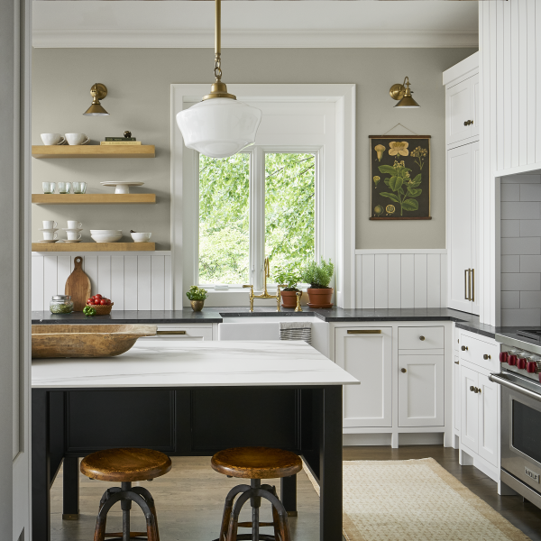 Custom kitchen with neutral wood tones and shiplap backsplash