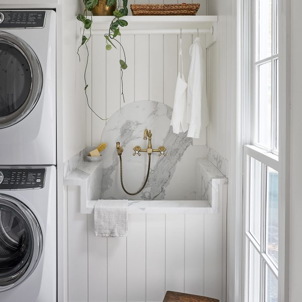 Custom laundry room with shiplap and marble back splash